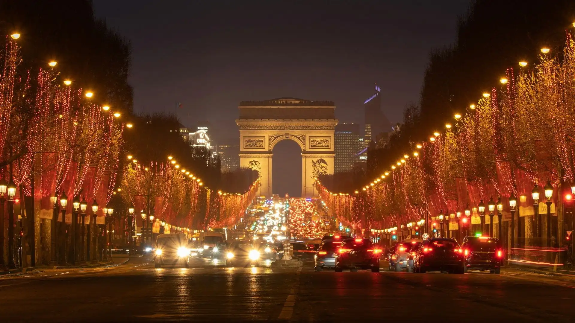 Christmas lights in the trees along the Champs-Élysées with the Arc de Triomphe Christmas lights in the trees along the Champs-Élysées with the Arc de Triomphe