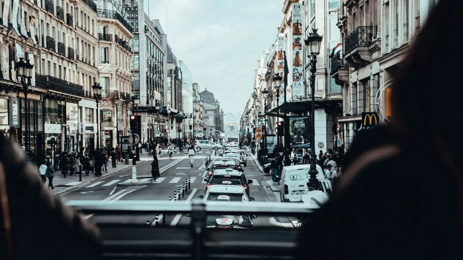 View down a Paris boulevard from the upper deck of a sightseeing bus