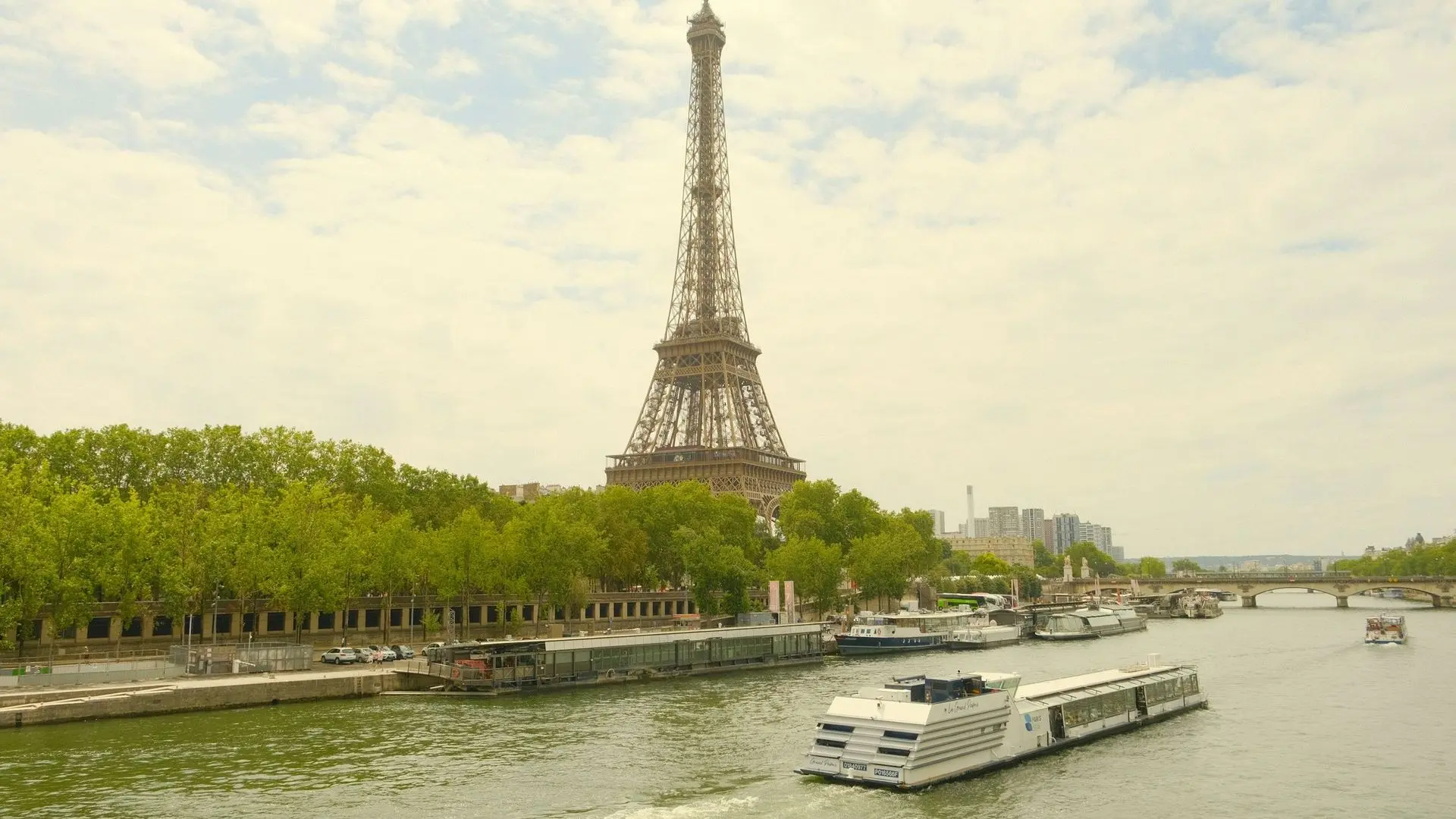 Eiffel Tower above a sightseeing boat on the Seine Eiffel Tower above a sightseeing boat on the Seine